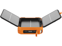 Charger l&#39;image dans la galerie, Chargeur solaire orange avec panneaux ouverts. Ports USB et une lumière.
